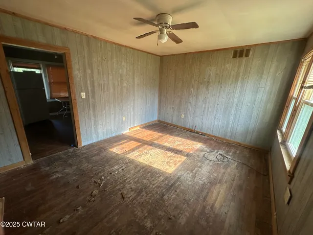 a view of empty room with windows