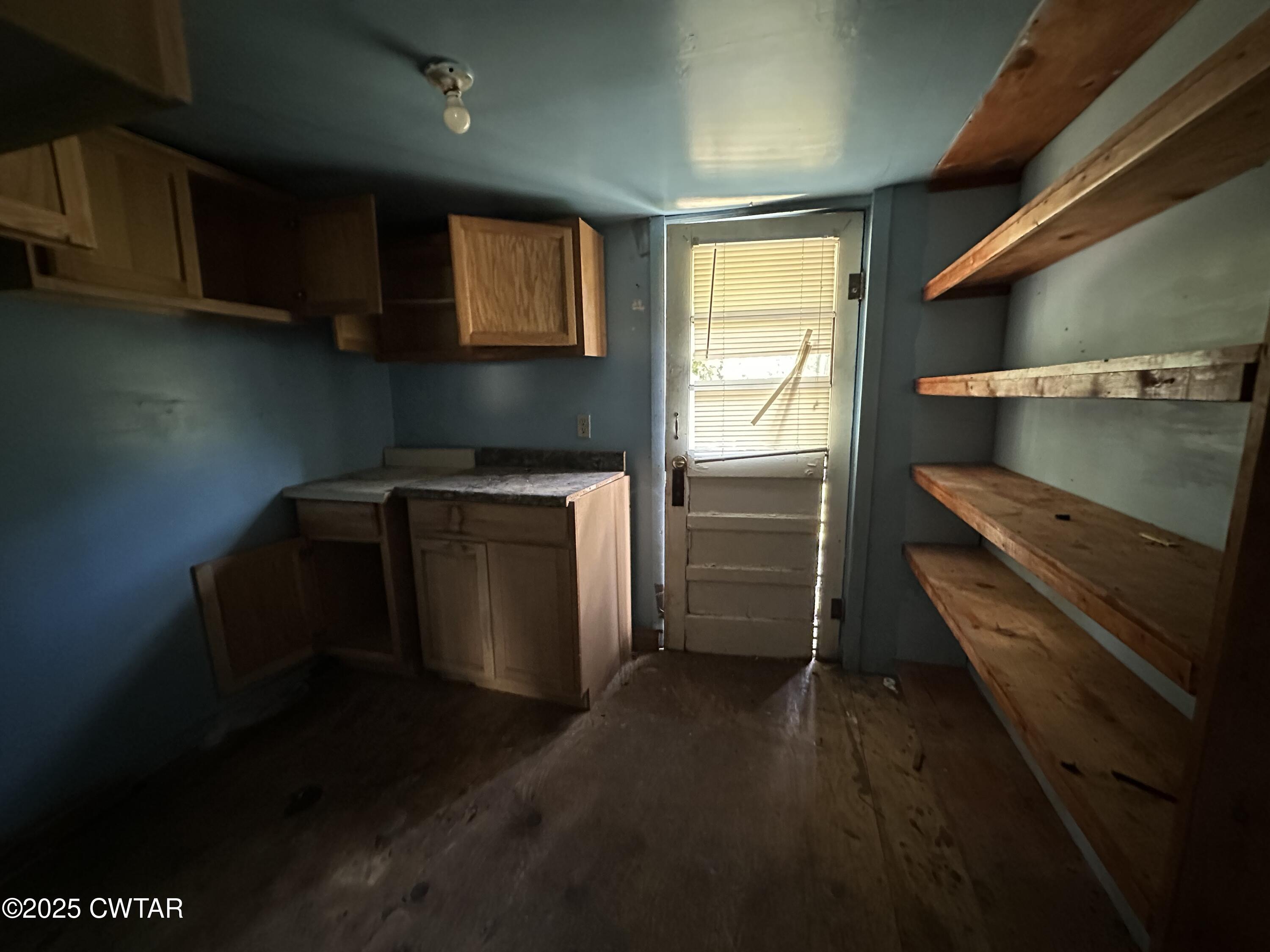 3016 Terry Street Milan, TN 38358 - Photo 7 of 16 a kitchen with a stove and a refrigerator