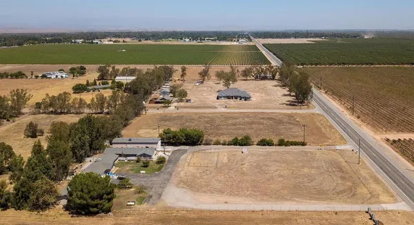 an aerial view of a house with a lake view