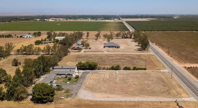 an aerial view of a house with a lake view