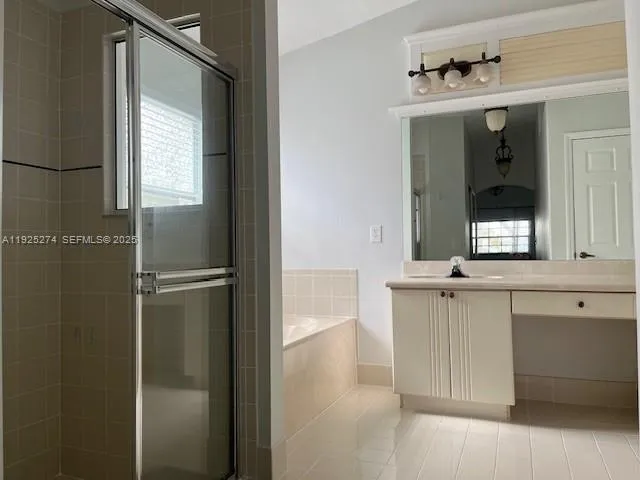 a white bath tub sitting next to a window