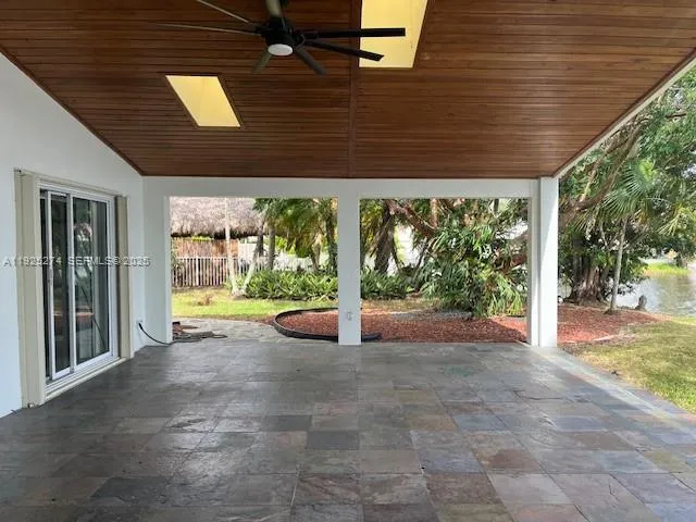 a view of a porch and garden