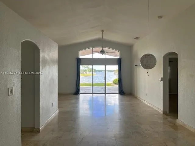 a view of an empty room with a window