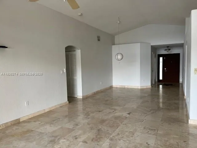 a view of a kitchen with a refrigerator and an oven
