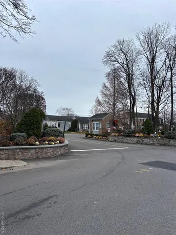 a view of city street with a house