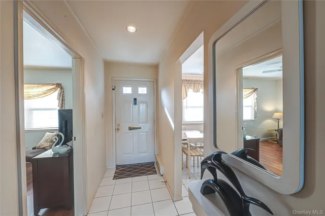 a view of a hallway with living room and a couch