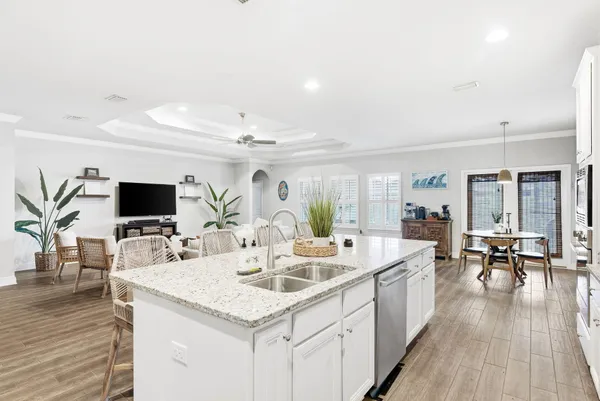 a kitchen with a sink stove and refrigerator