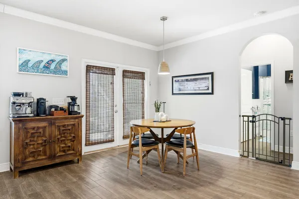 a view of a dining room with furniture window and wooden floor