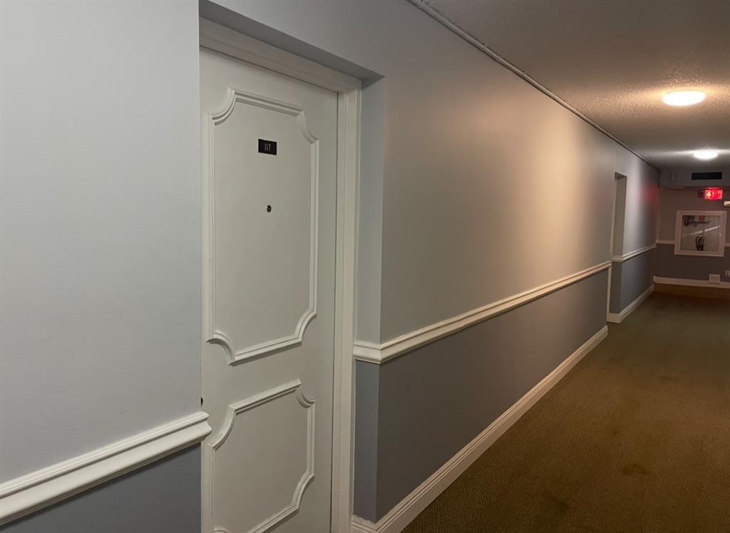 9273 Southwest 8th Street, Unit 117 Boca Raton, FL 33428 - Photo 4 of 7 a view of an empty room