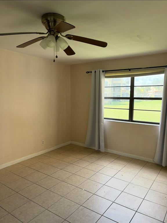 9273 Southwest 8th Street, Unit 117 Boca Raton, FL 33428 - Photo 6 of 7 an empty room with a window