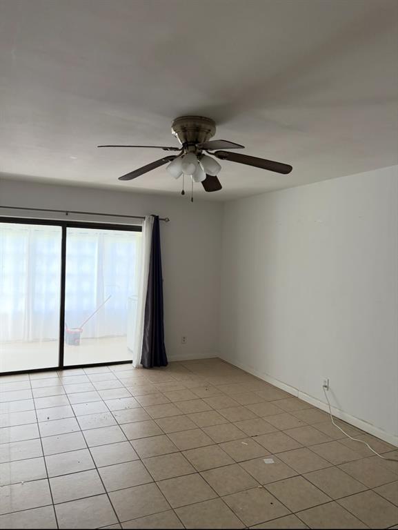 9273 Southwest 8th Street, Unit 117 Boca Raton, FL 33428 - Photo 7 of 7 a view of an empty room and window