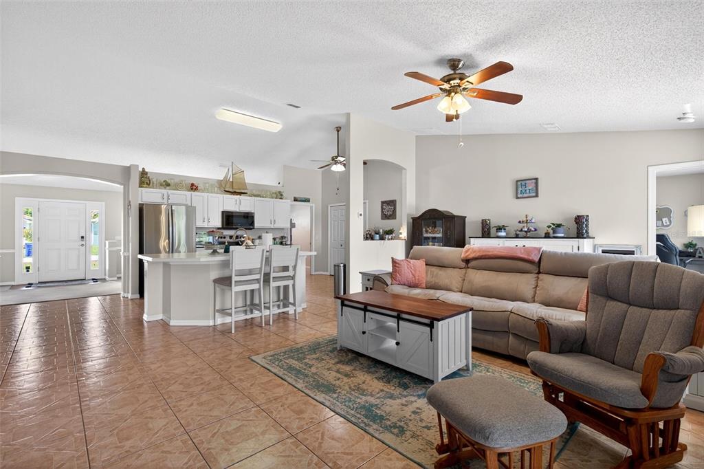 341 Mariners Gate Drive Edgewater, FL 32141 - Photo 11 of 53 a living room with furniture and kitchen view