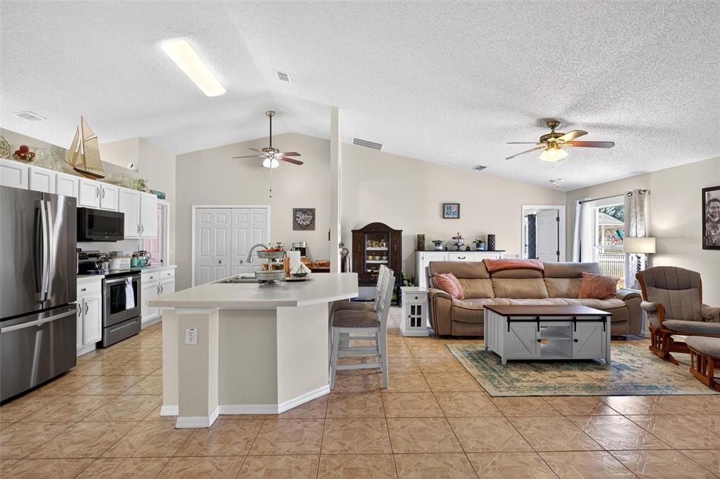341 Mariners Gate Drive Edgewater, FL 32141 - Photo 15 of 53 a living room with furniture and a flat screen tv