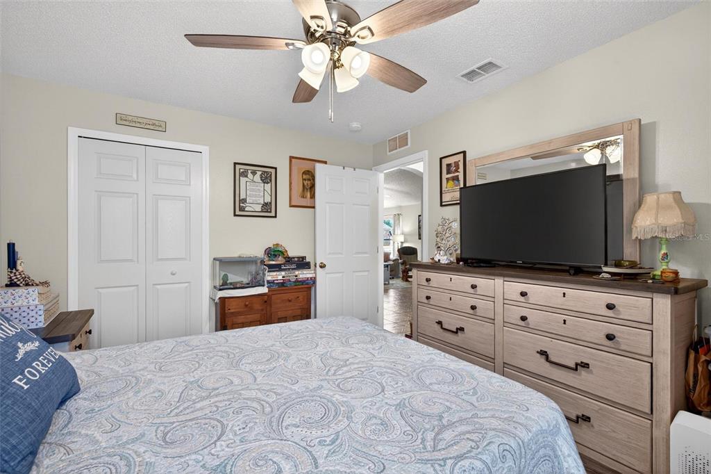341 Mariners Gate Drive Edgewater, FL 32141 - Photo 28 of 53 a bedroom with a bed and a flat screen tv