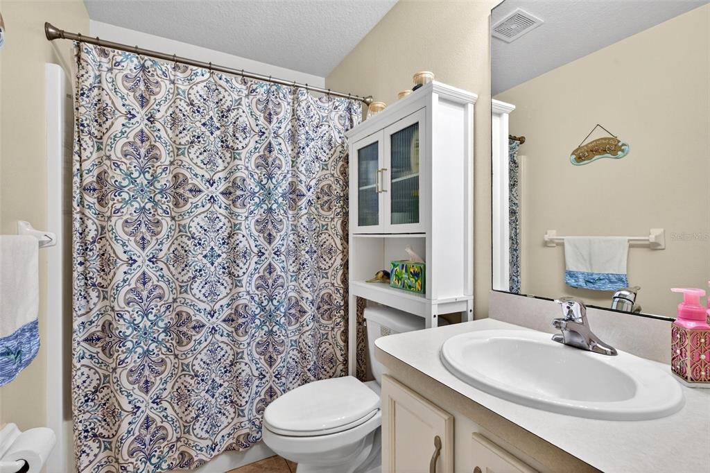 341 Mariners Gate Drive Edgewater, FL 32141 - Photo 30 of 53 a bathroom with a sink toilet and shower
