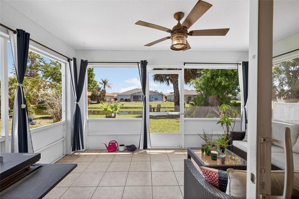 341 Mariners Gate Drive Edgewater, FL 32141 - Photo 36 of 53 a living room filled with furniture and a large window