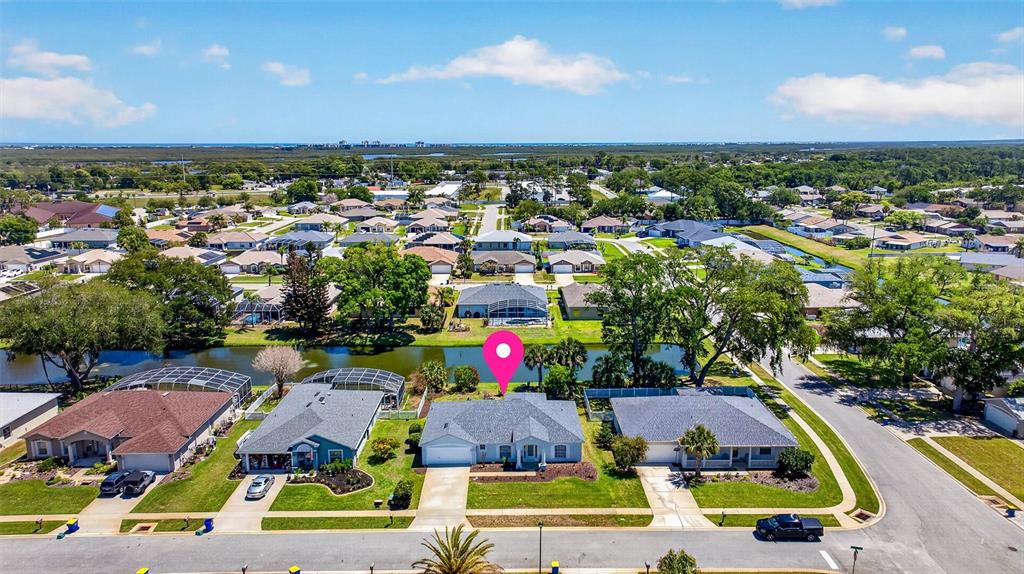 341 Mariners Gate Drive Edgewater, FL 32141 - Photo 50 of 53 an aerial view of residential houses with outdoor space and swimming pool