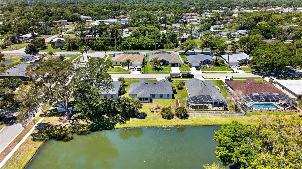 341 Mariners Gate Drive Edgewater, FL 32141 - Photo 52 of 53 an aerial view of residential houses with outdoor space and lake view