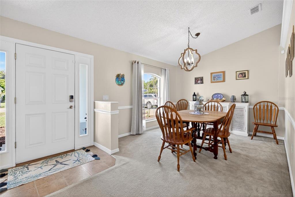 341 Mariners Gate Drive Edgewater, FL 32141 - Photo 8 of 53 a view of a dining room with furniture and window