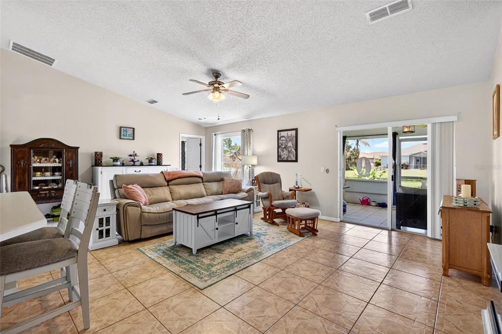 341 Mariners Gate Drive Edgewater, FL 32141 - Photo 10 of 53 a living room with furniture and wooden floor