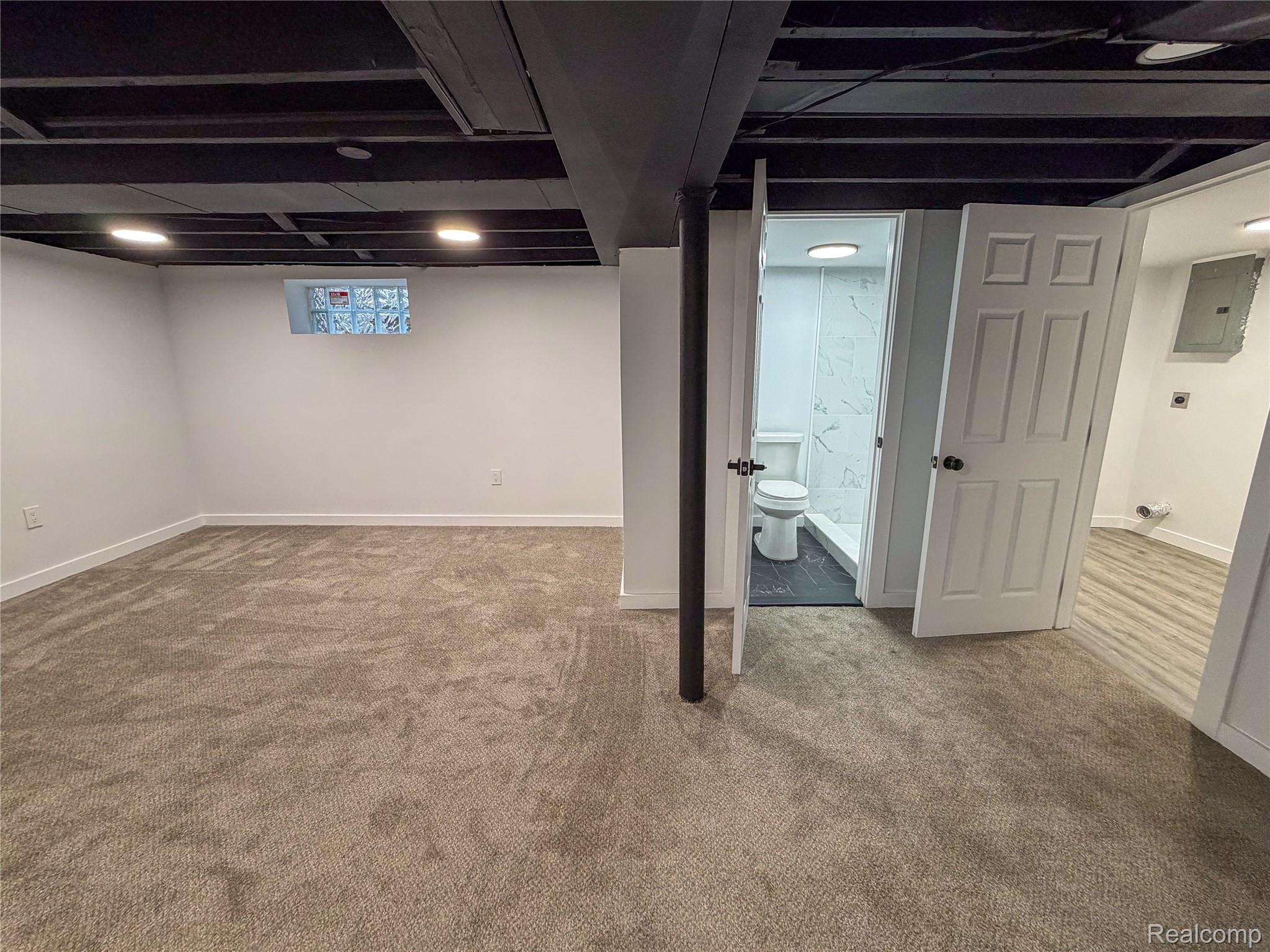 18217 Prairie Street Detroit, MI 48221 - Photo 24 of 34 Carpeted room with a painted exposed ceiling featuring recessed lighting