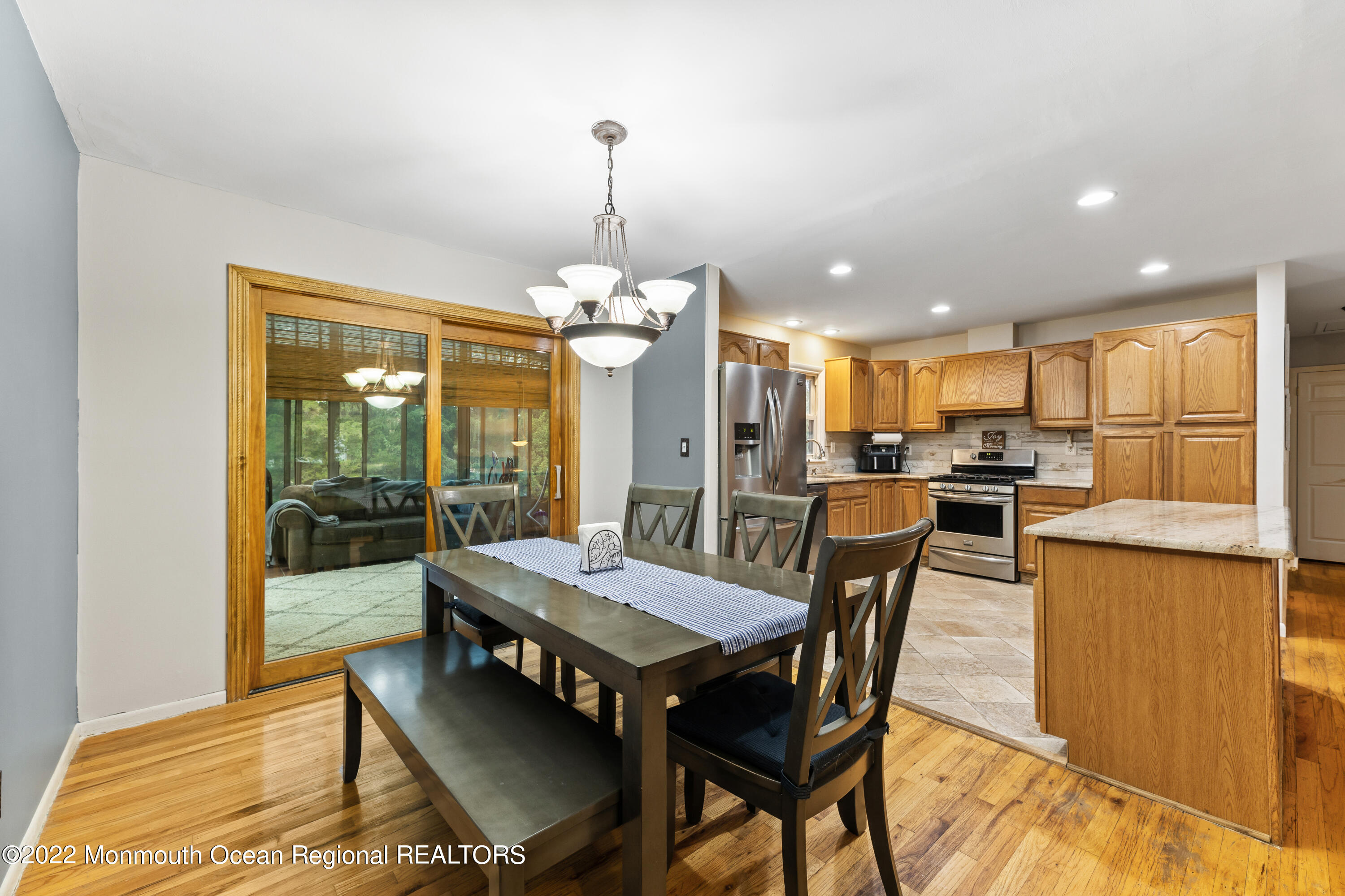 21 Holiday Road Manalapan, NJ 07726 - Photo 13 of 30 a view of a dining room with furniture window and wooden floor