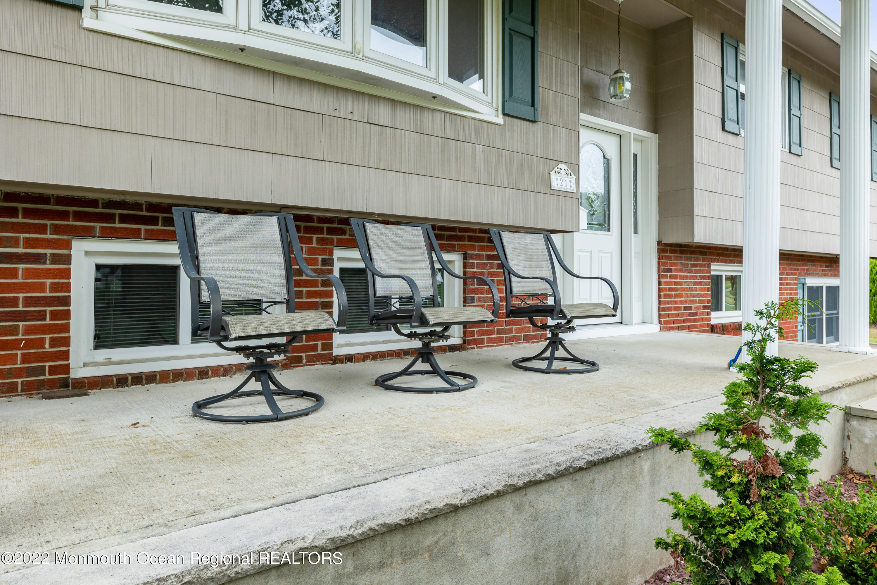 21 Holiday Road Manalapan, NJ 07726 - Photo 2 of 30 a view of a gym with equipment and a table