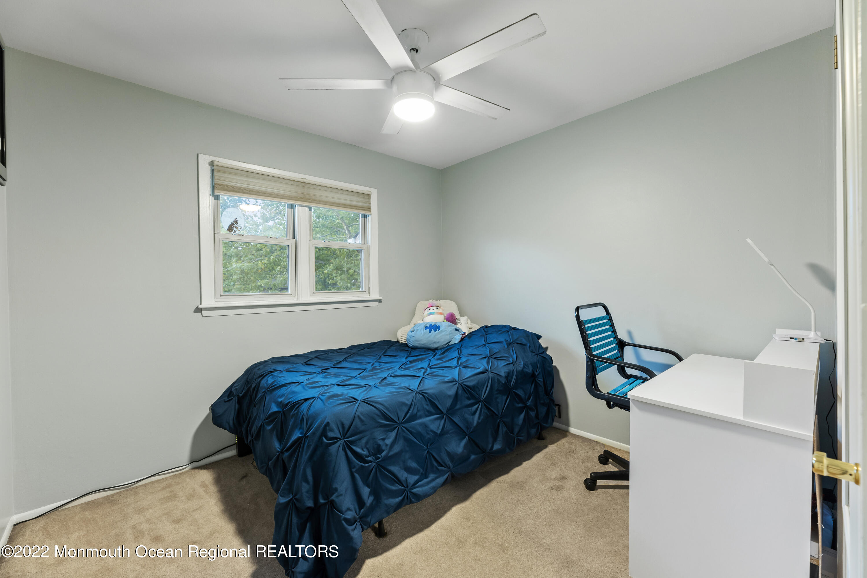 21 Holiday Road Manalapan, NJ 07726 - Photo 21 of 30 a bed room with a bed and a window