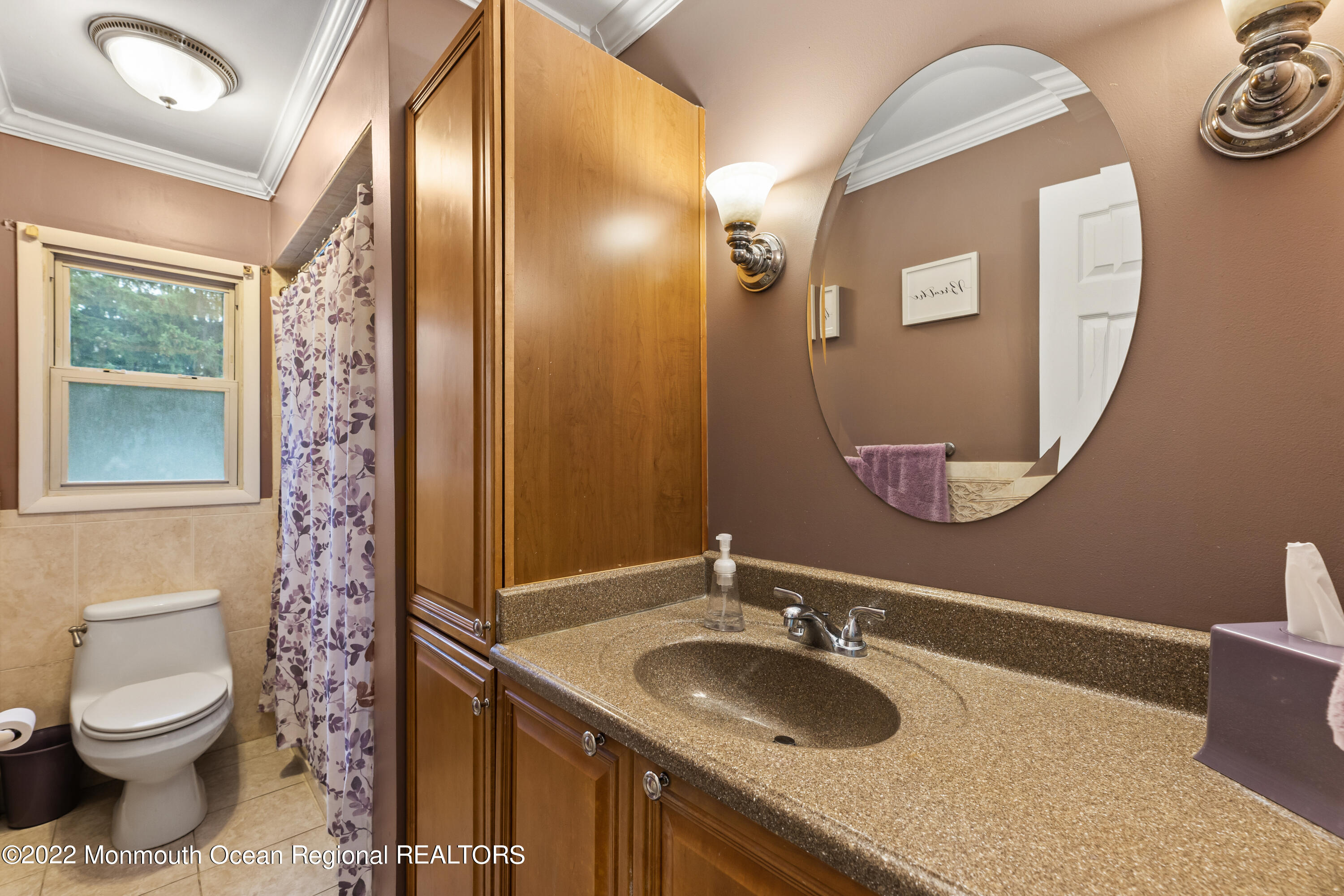 21 Holiday Road Manalapan, NJ 07726 - Photo 22 of 30 a bathroom with a granite countertop toilet sink and mirror