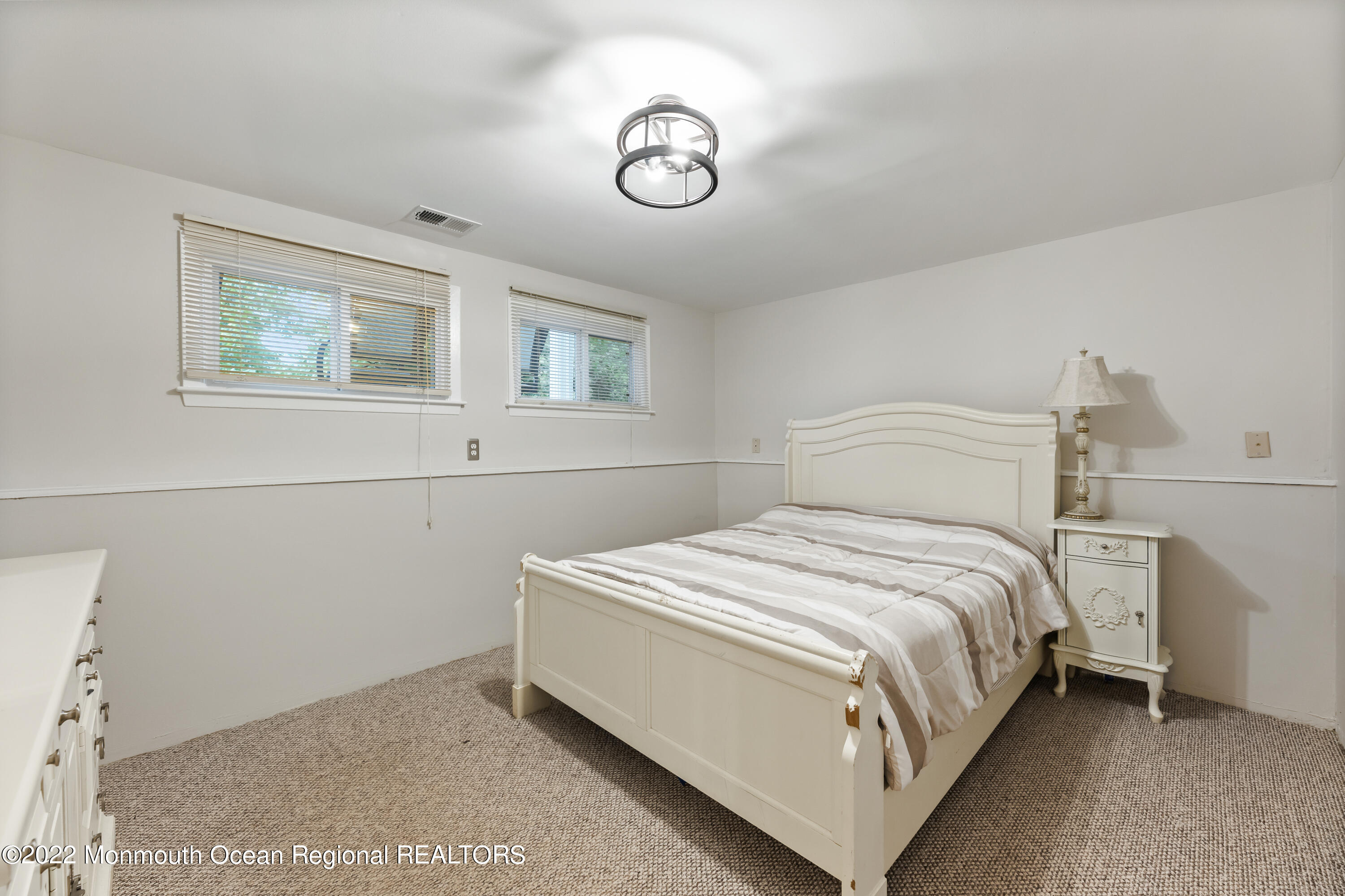 21 Holiday Road Manalapan, NJ 07726 - Photo 25 of 30 a bedroom with a bed and window