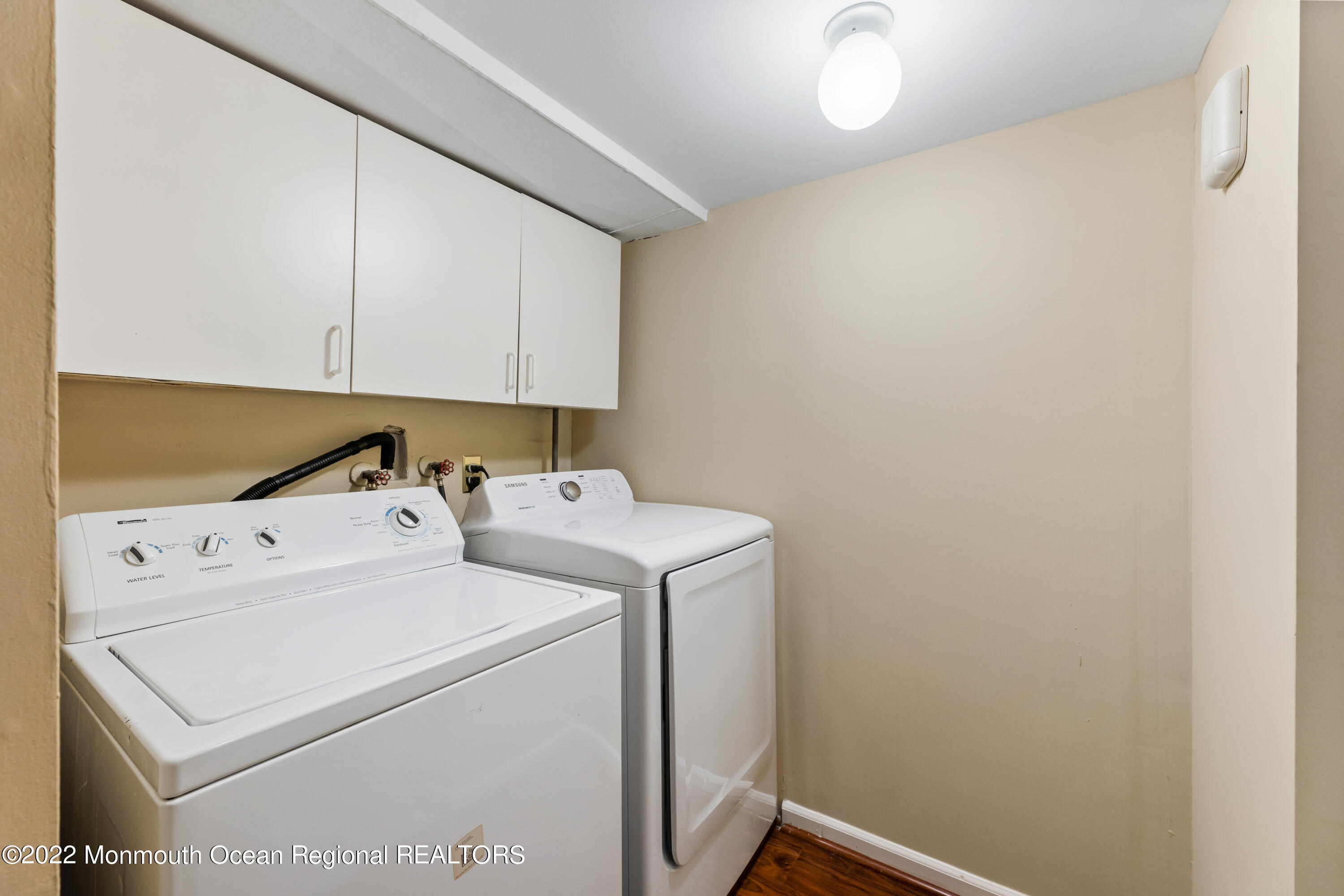 21 Holiday Road Manalapan, NJ 07726 - Photo 26 of 30 a utility room with dryer and washer