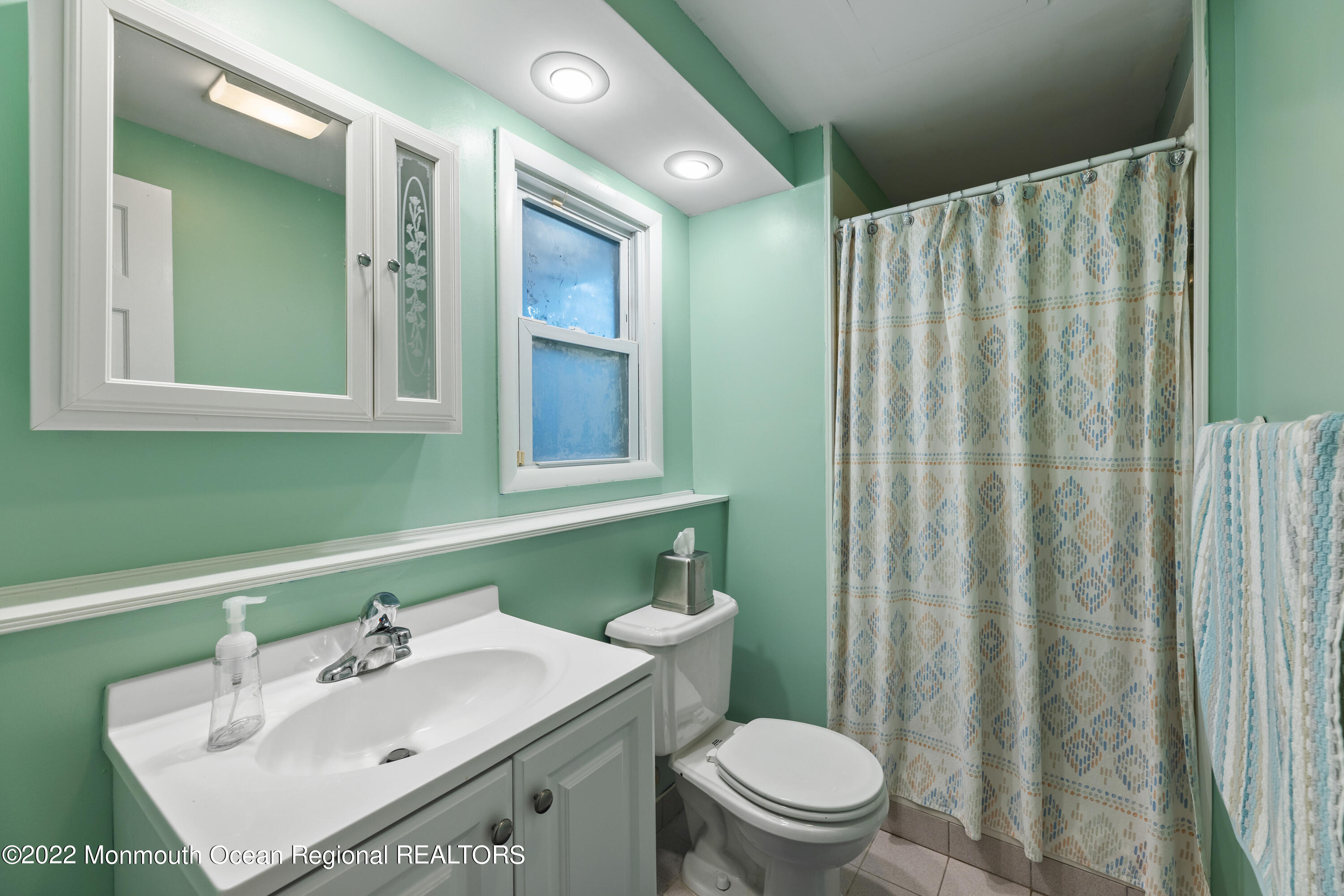 21 Holiday Road Manalapan, NJ 07726 - Photo 27 of 30 a bathroom with a sink toilet and shower