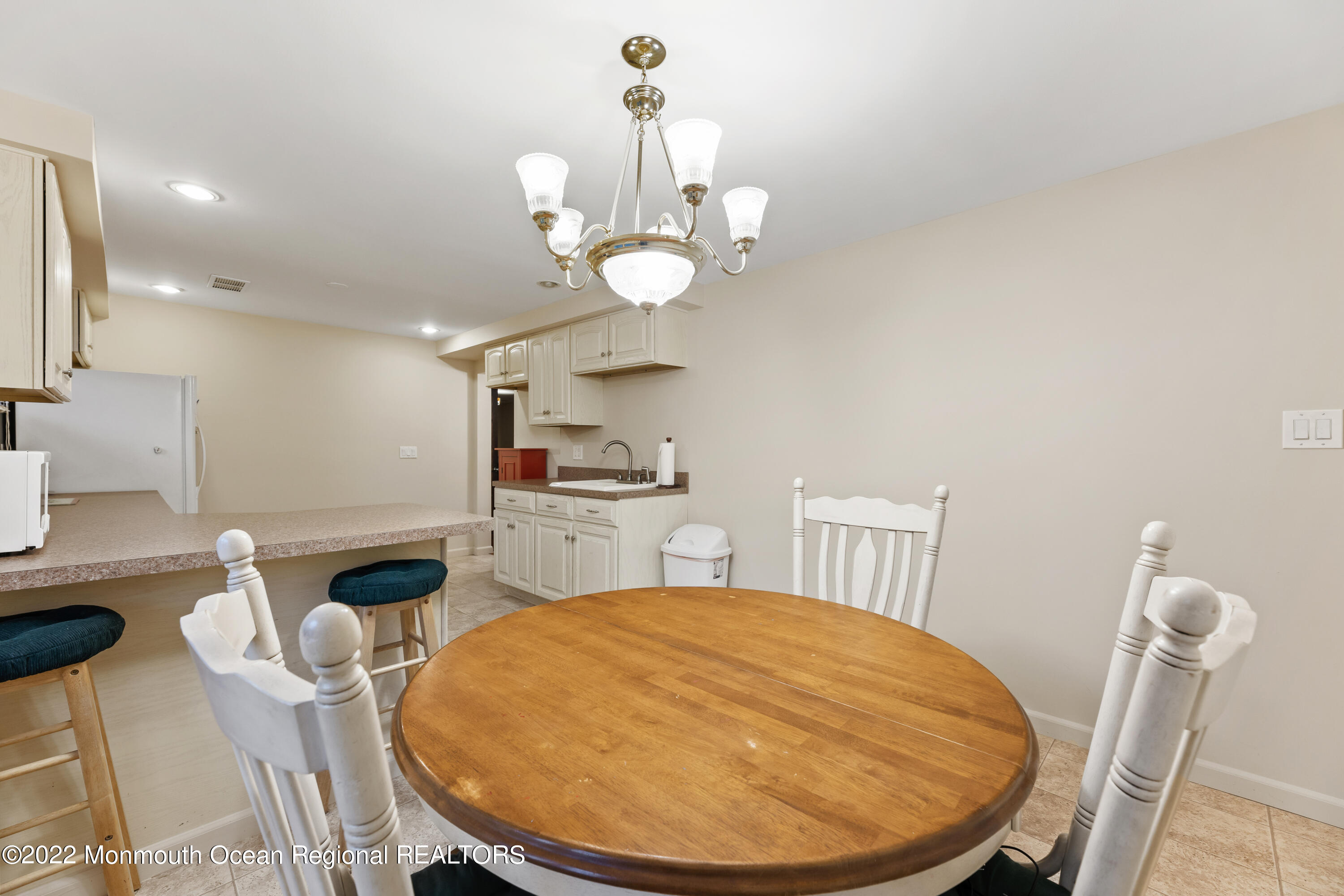 21 Holiday Road Manalapan, NJ 07726 - Photo 30 of 30 a view of a dining room with furniture