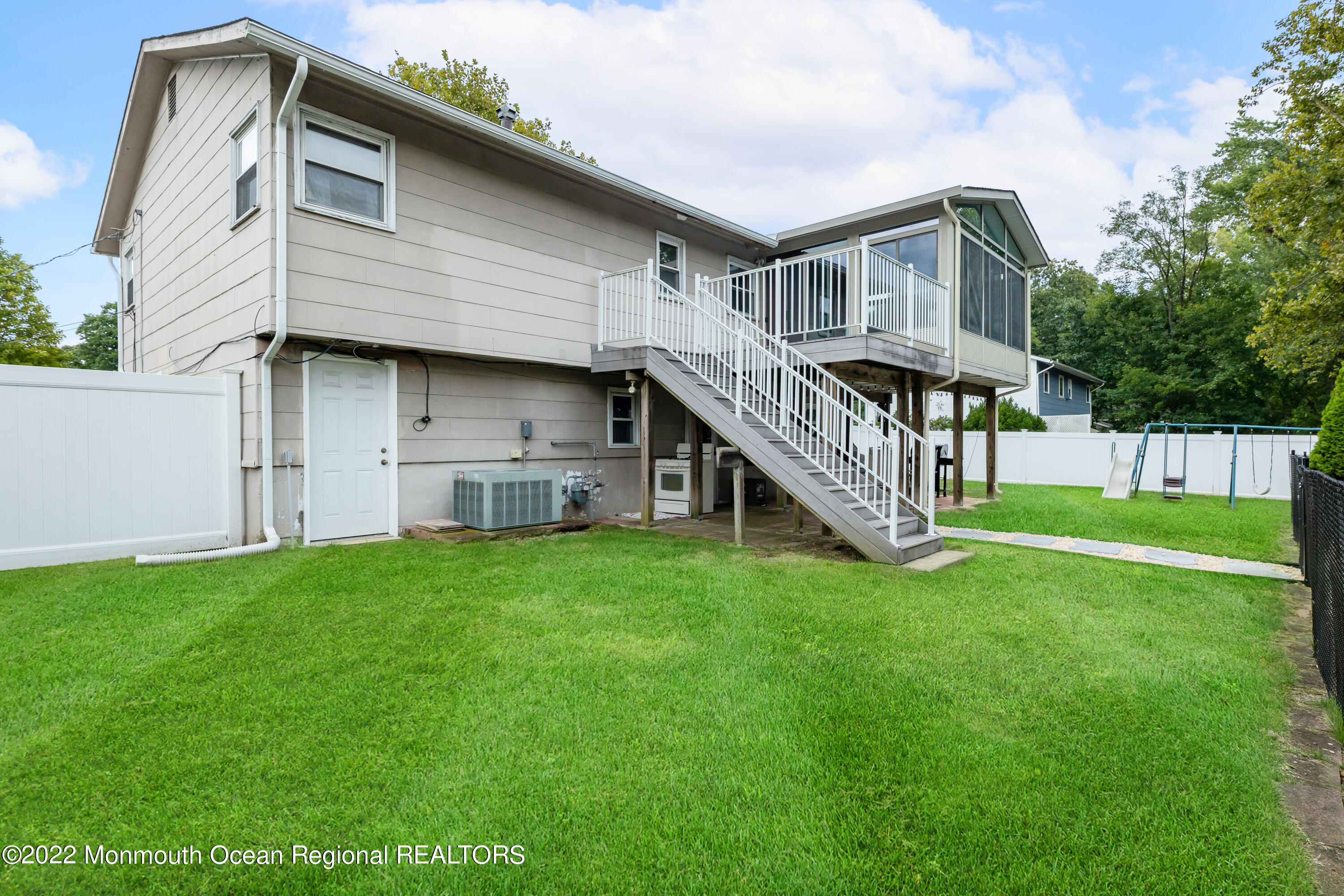21 Holiday Road Manalapan, NJ 07726 - Photo 4 of 30 a front view of house with yard and green space