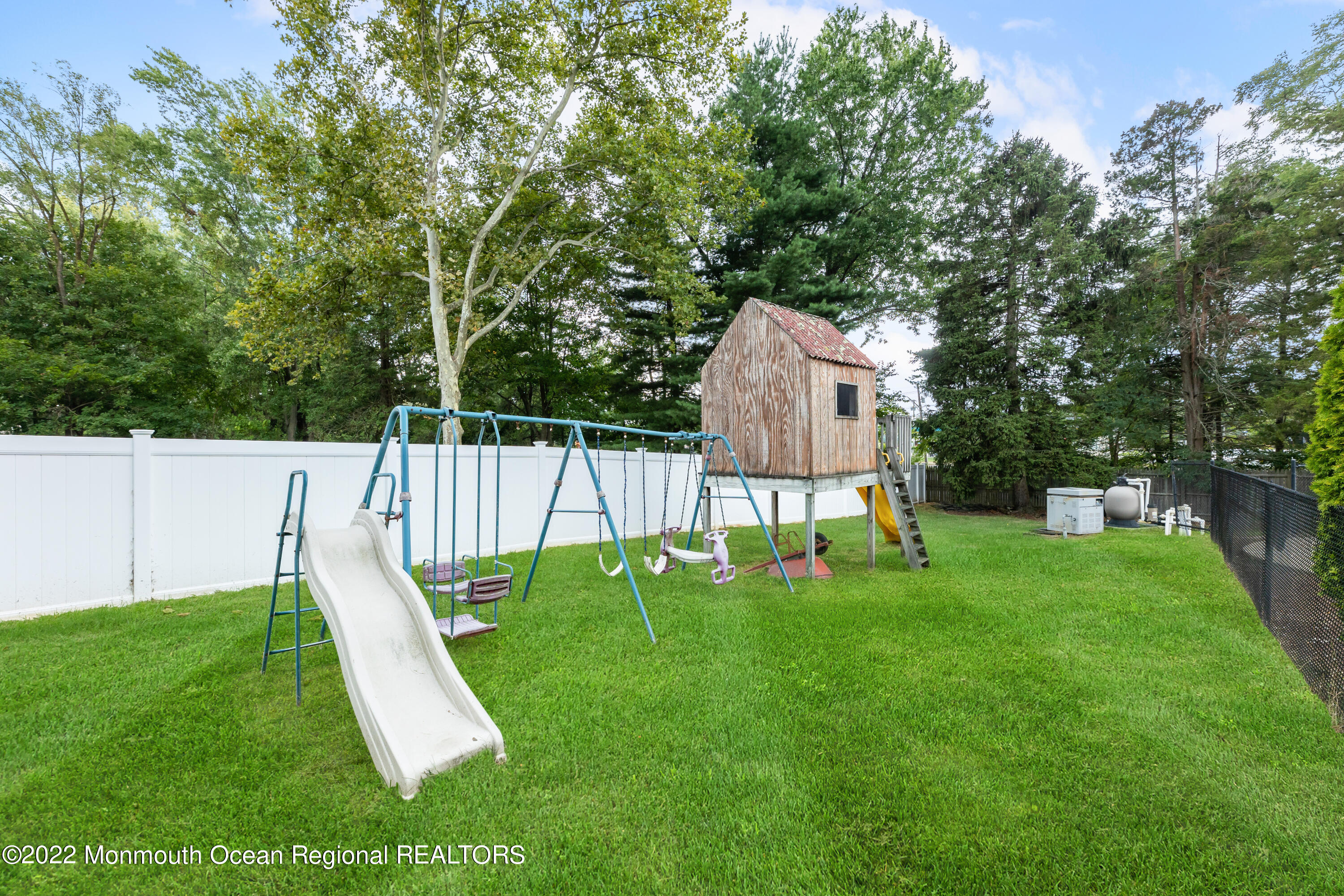 21 Holiday Road Manalapan, NJ 07726 - Photo 8 of 30 a view of a garden with a slide