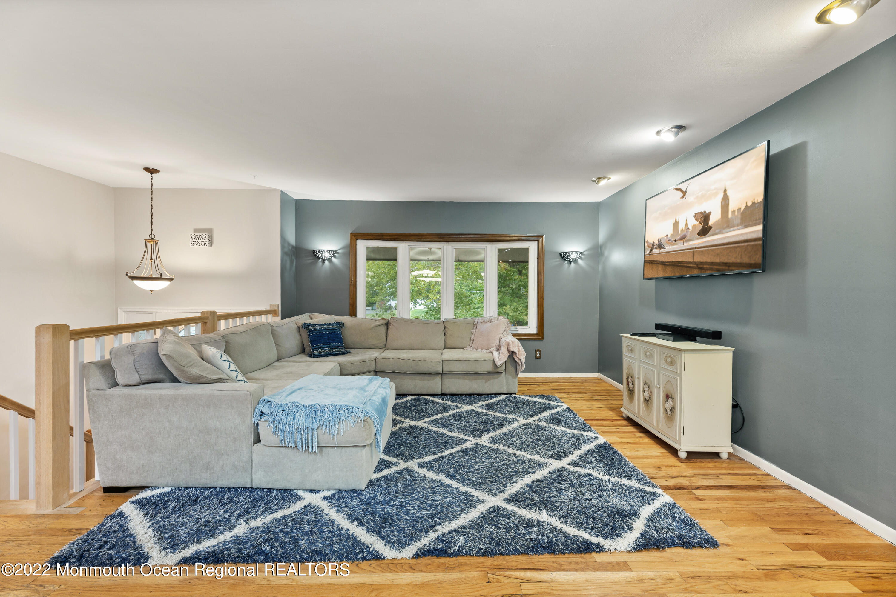 21 Holiday Road Manalapan, NJ 07726 - Photo 10 of 30 a living room with furniture and a flat screen tv