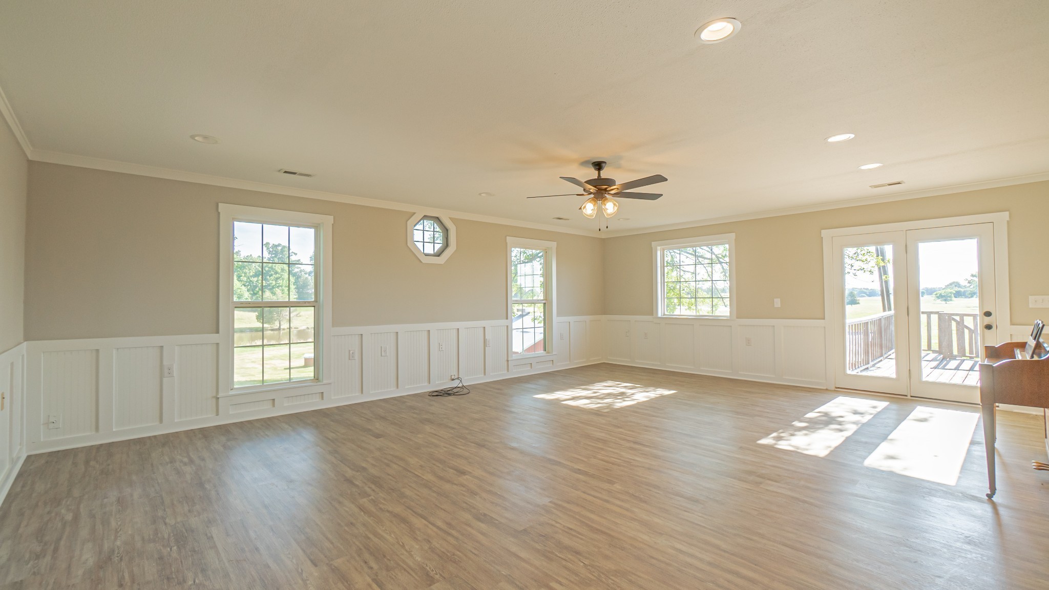 299 Piper Road Portland, TN 37148 - Photo 11 of 34 a view of an empty room with wooden floor and a window