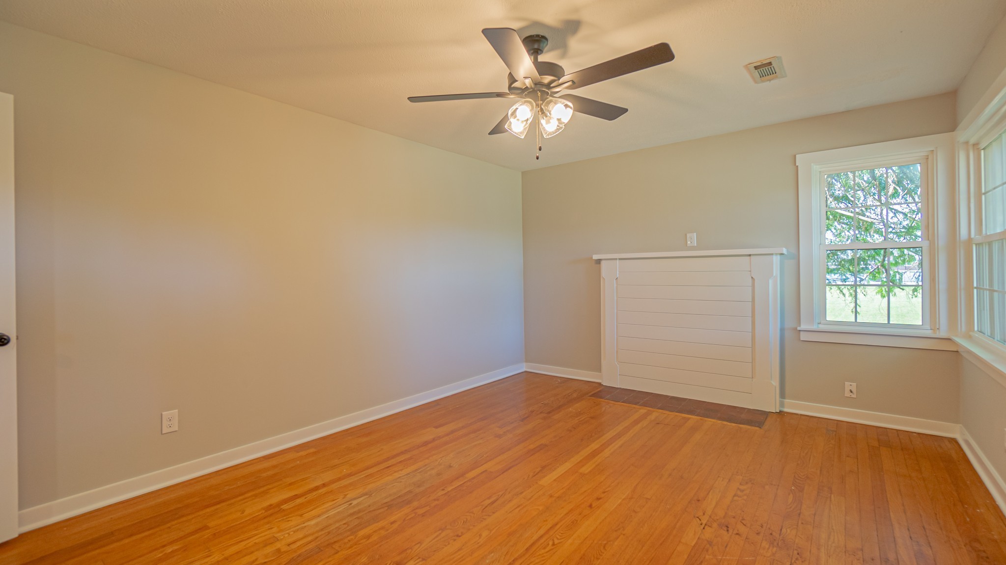 299 Piper Road Portland, TN 37148 - Photo 12 of 34 wooden floor in an empty room with a window