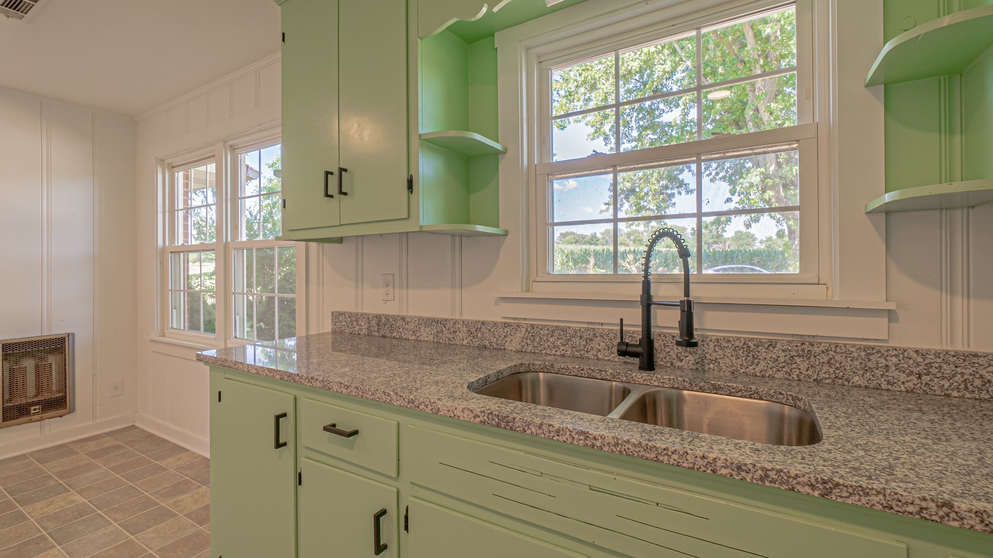 299 Piper Road Portland, TN 37148 - Photo 15 of 34 a kitchen sink with a window and cabinets