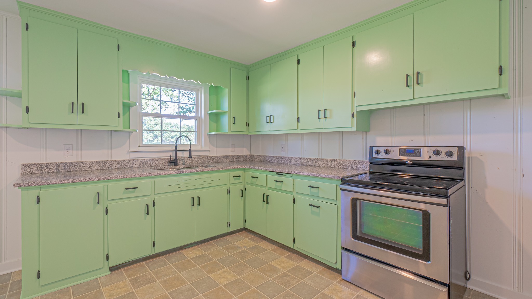 299 Piper Road Portland, TN 37148 - Photo 16 of 34 a kitchen with stainless steel appliances granite countertop a sink a stove and cabinets