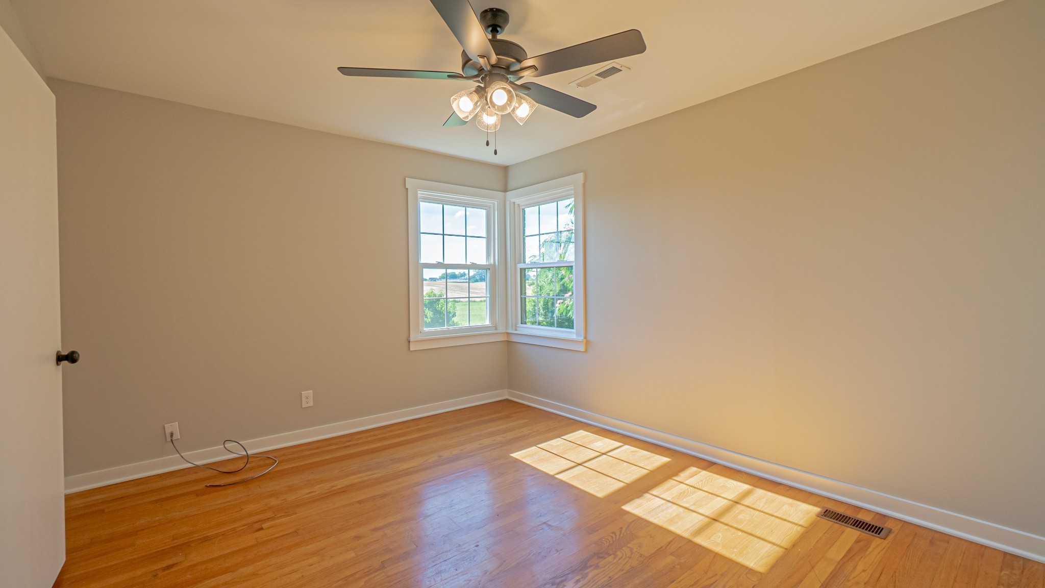 299 Piper Road Portland, TN 37148 - Photo 24 of 34 an empty room with a window and a ceiling fan