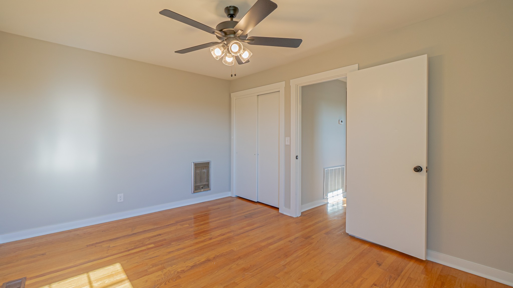299 Piper Road Portland, TN 37148 - Photo 26 of 34 an empty room with wooden floor and windows