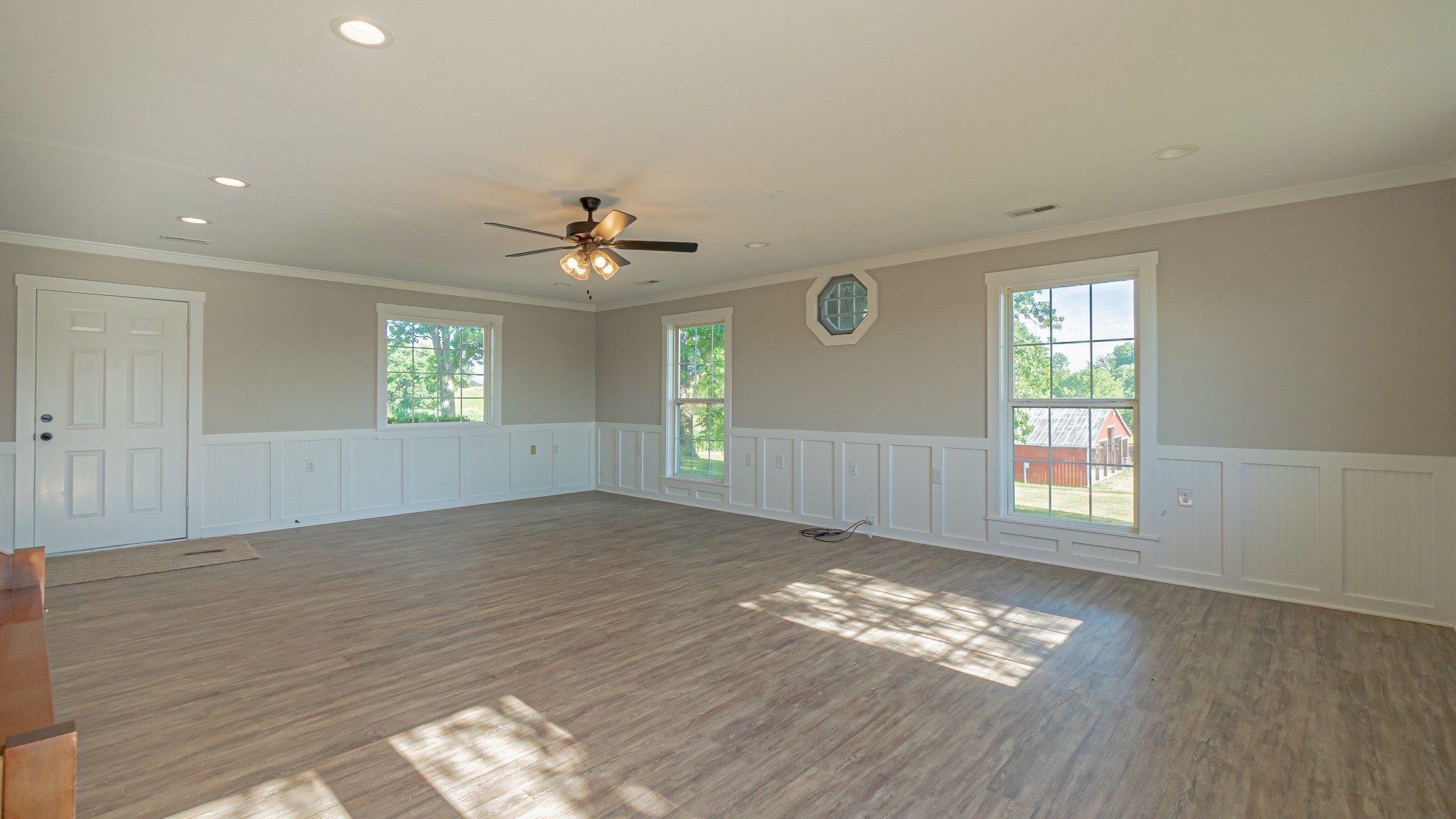 299 Piper Road Portland, TN 37148 - Photo 27 of 34 a view of empty room with wooden floor and fan