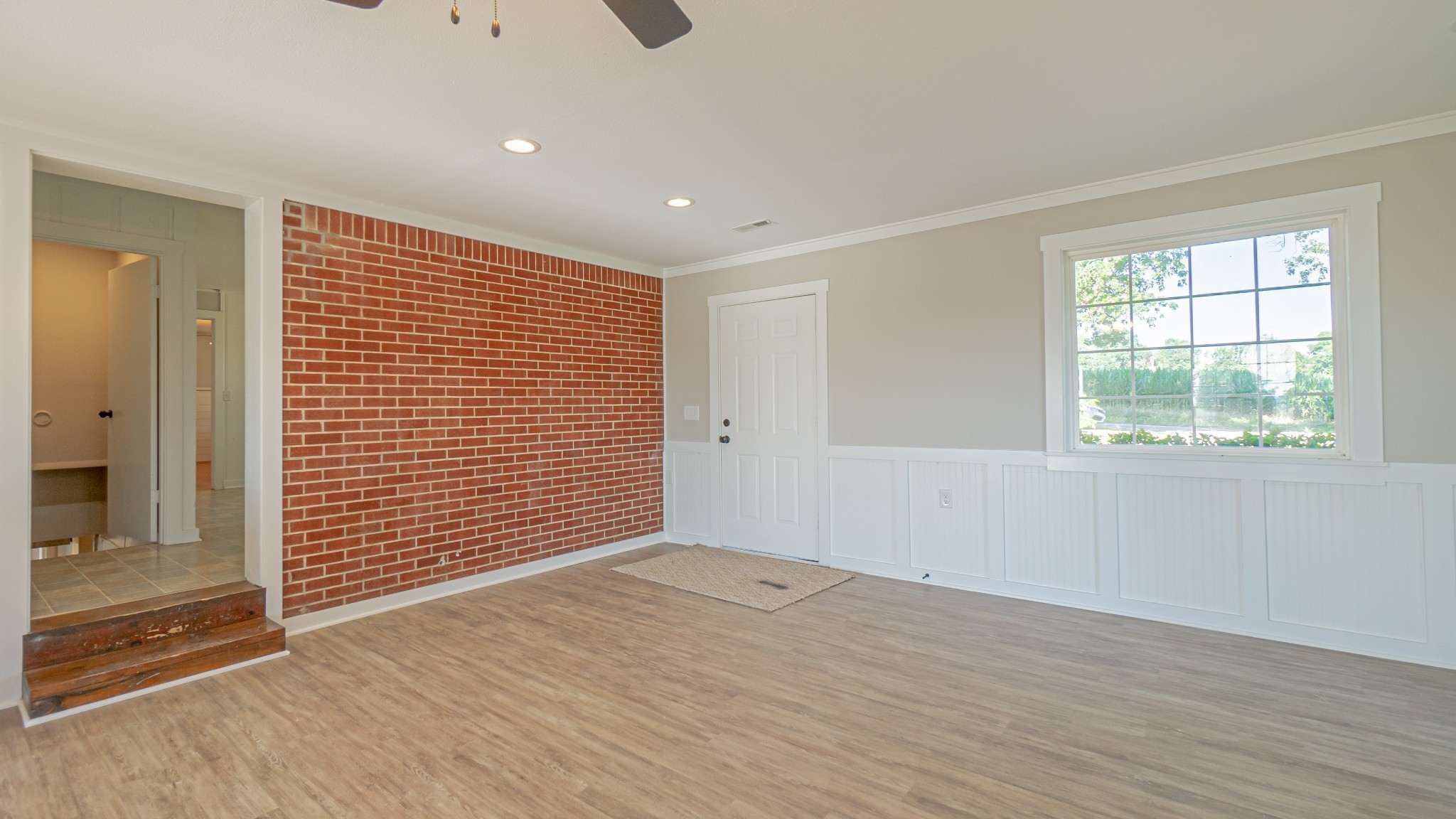 299 Piper Road Portland, TN 37148 - Photo 28 of 34 a view of an empty room with wooden floor and a window
