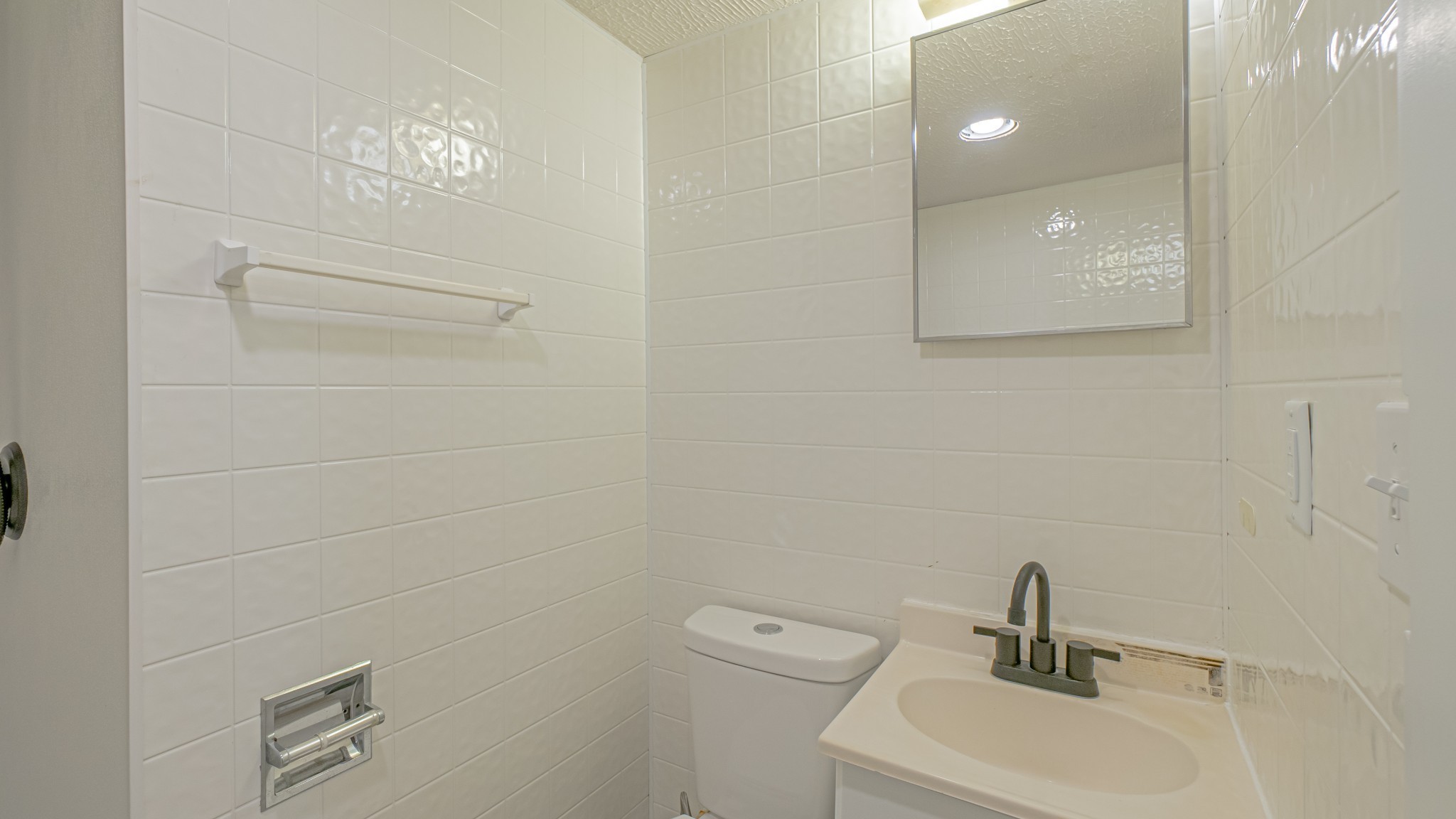 299 Piper Road Portland, TN 37148 - Photo 30 of 34 a bathroom with a sink a toilet and mirror