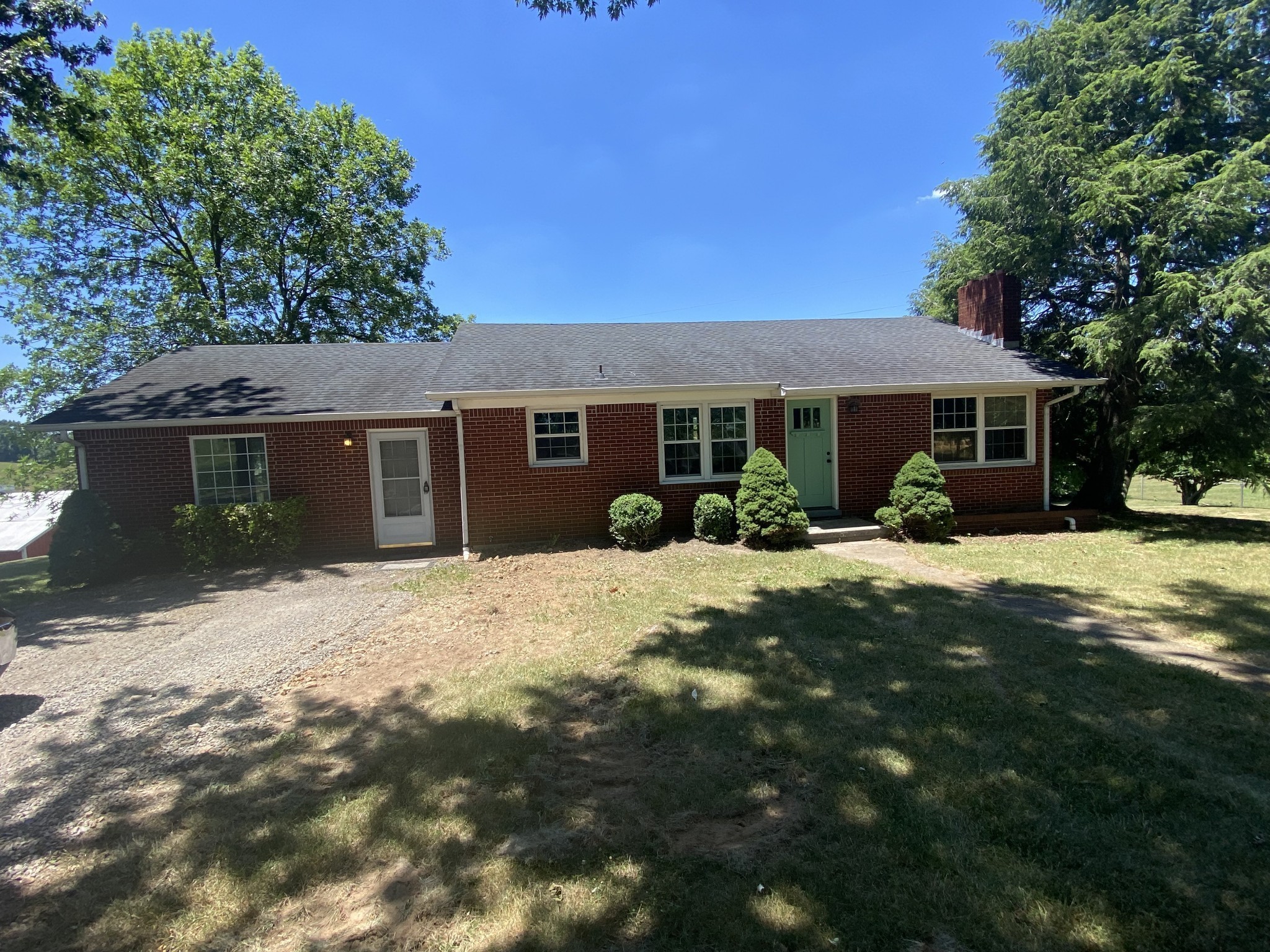 299 Piper Road Portland, TN 37148 - Photo 3 of 34 a front view of a house with a yard