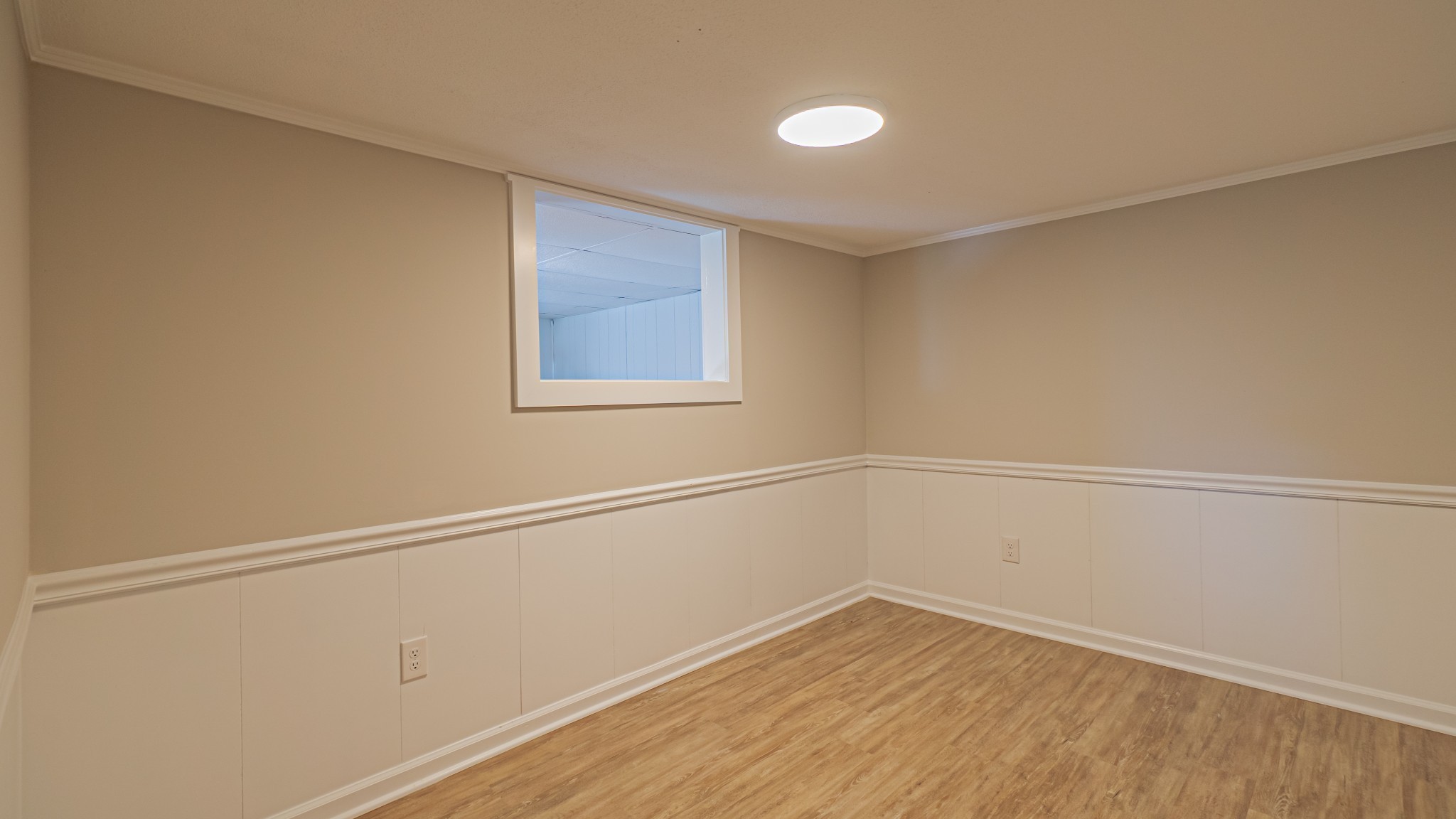299 Piper Road Portland, TN 37148 - Photo 31 of 34 a view of an empty room with wooden floor and a window