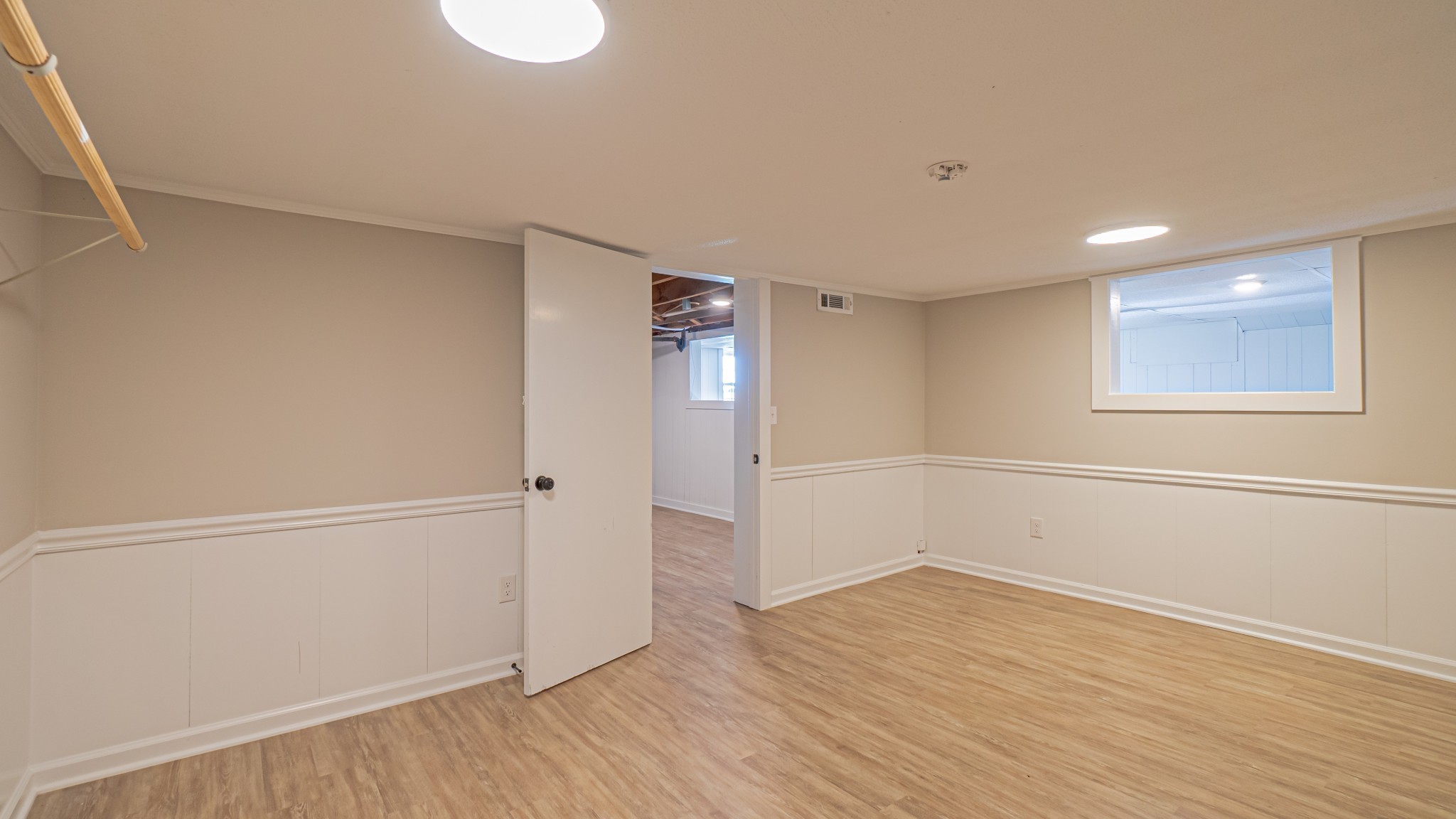 299 Piper Road Portland, TN 37148 - Photo 32 of 34 a view of an empty room with wooden floor and a window