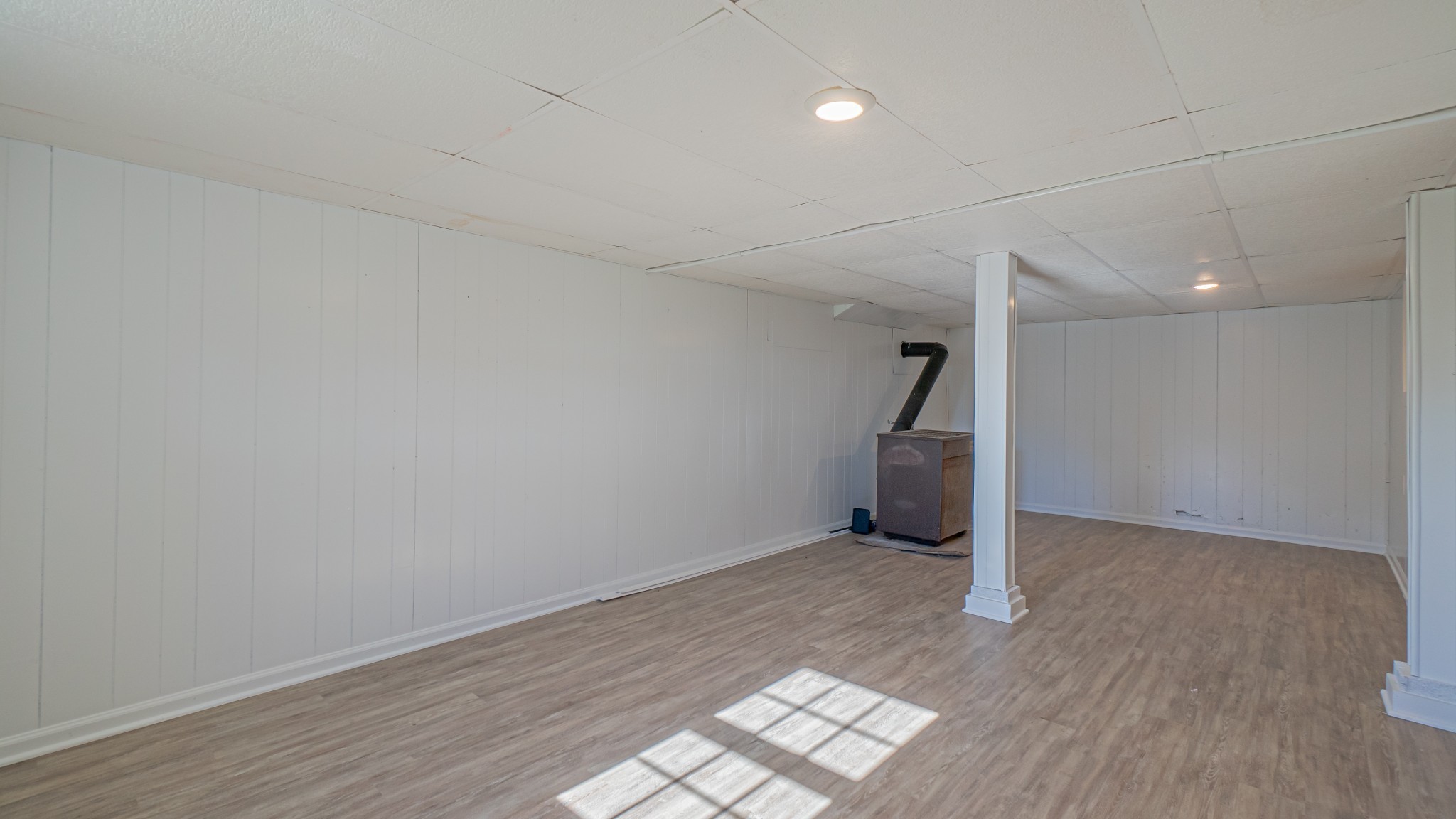 299 Piper Road Portland, TN 37148 - Photo 33 of 34 an empty room with wooden floor and entryway