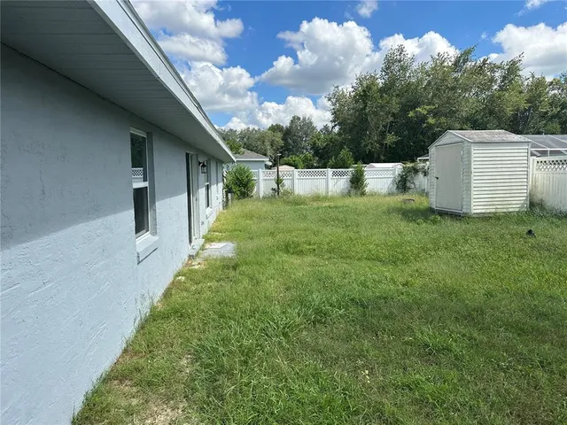 a backyard of a house with lots of green space